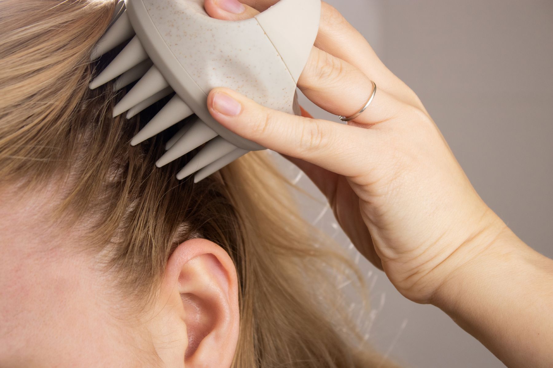 Brushing hair and scalp massage to stimulate hair growth
