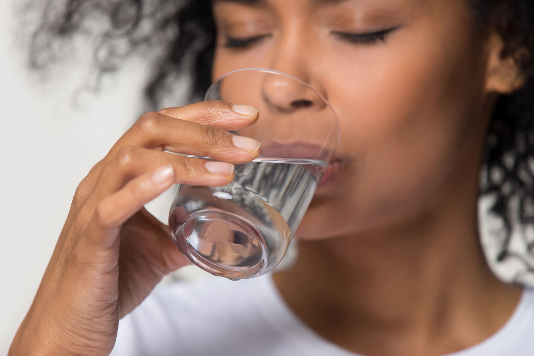 Drinking plenty of water to aid in hair health