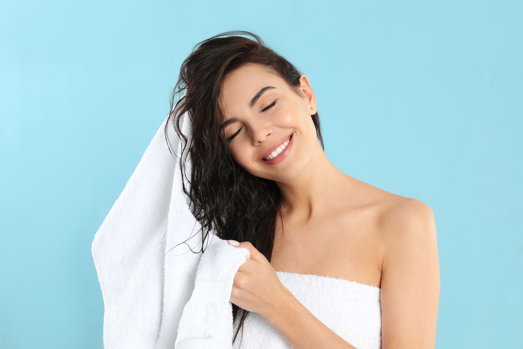 Woman rubbing her hair dry