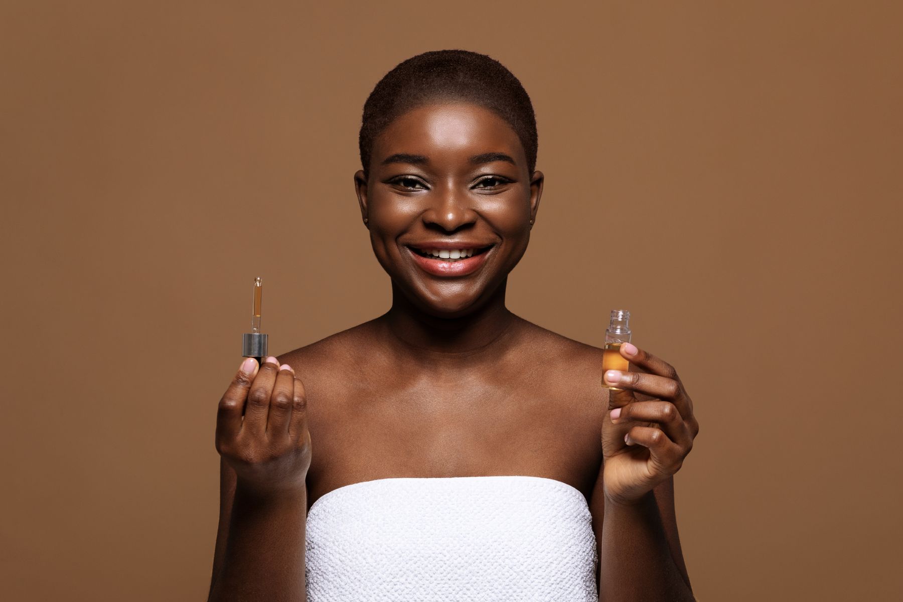 Woman using essential oils for hair