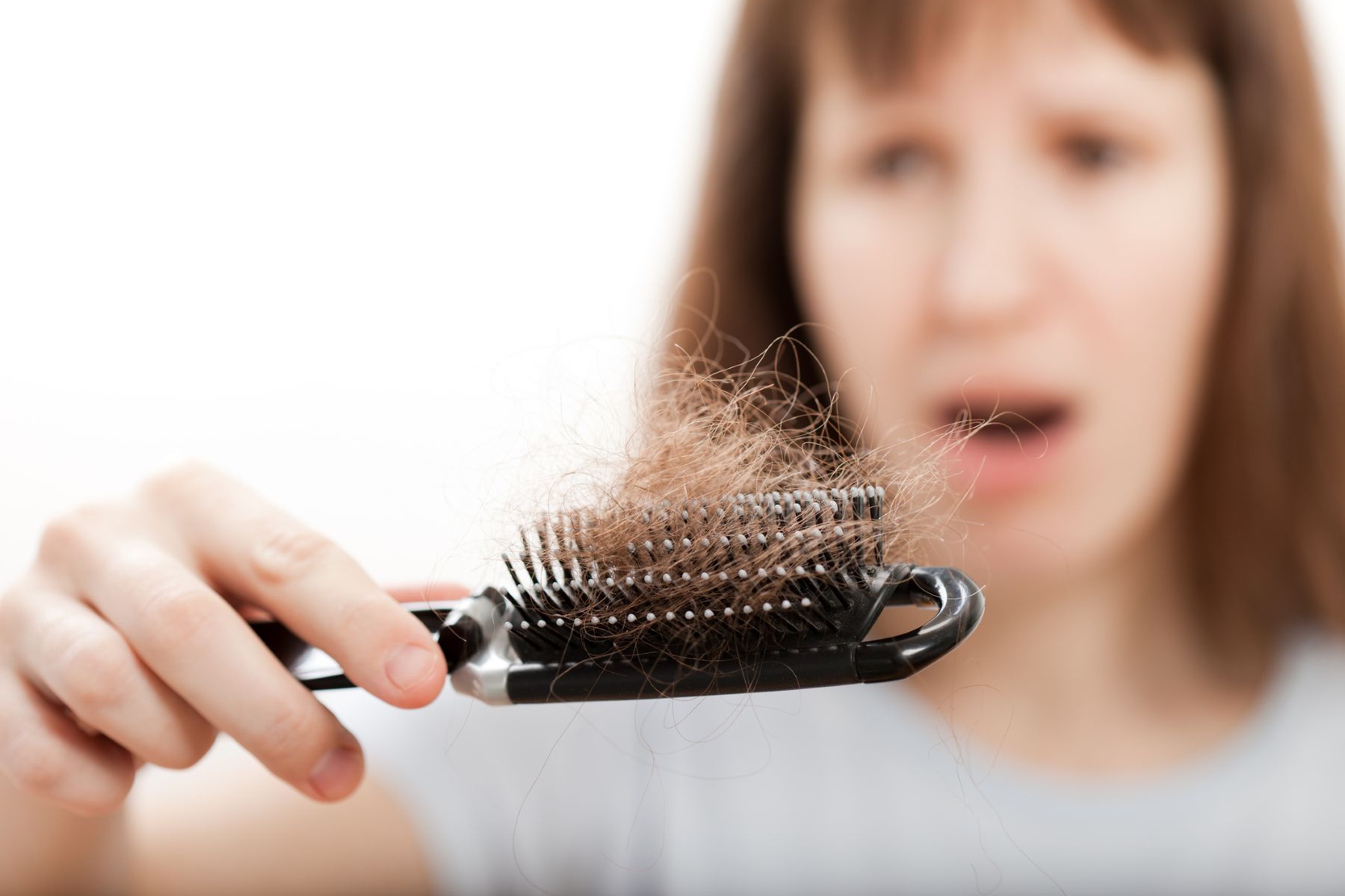 woman shocked at hair shedding