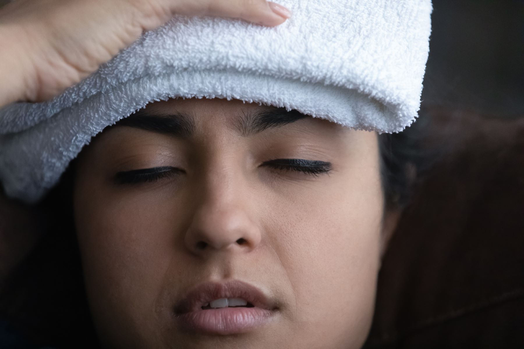 Woman treating her tender scalp at home