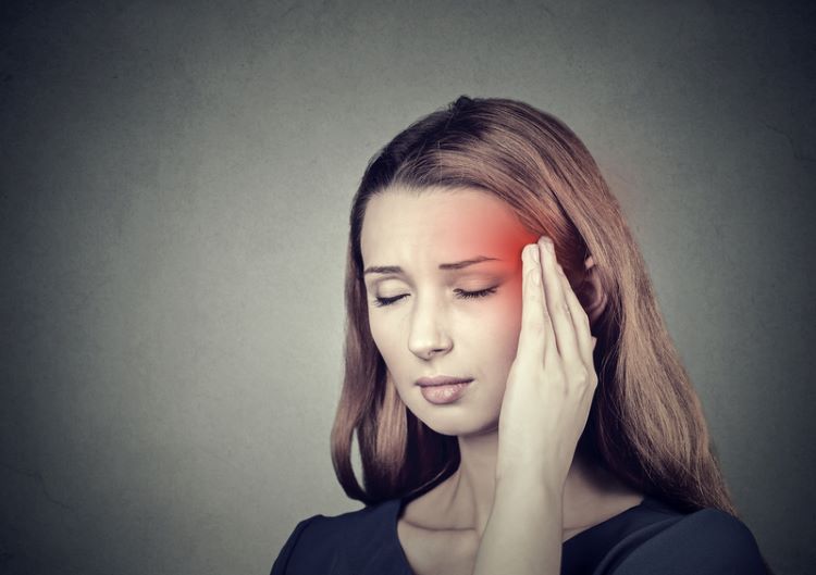 Woman having a migraine