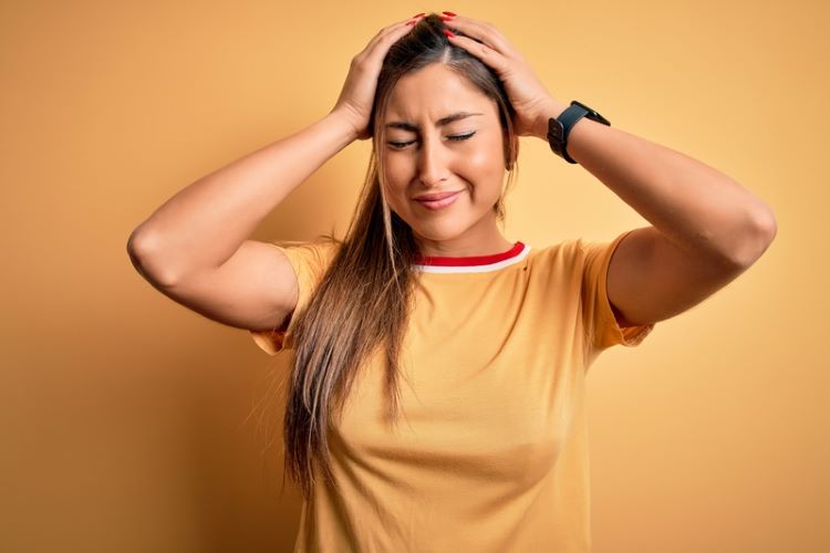 Woman with tension scalp pain