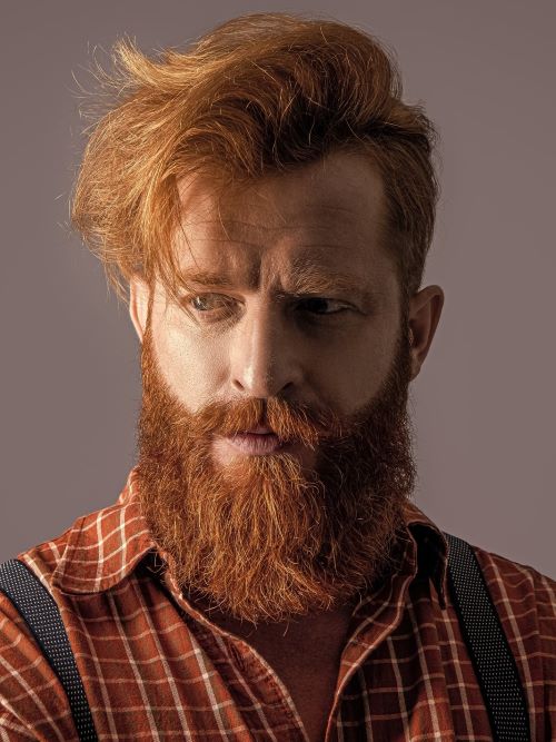Asymmetrical side-parted hair