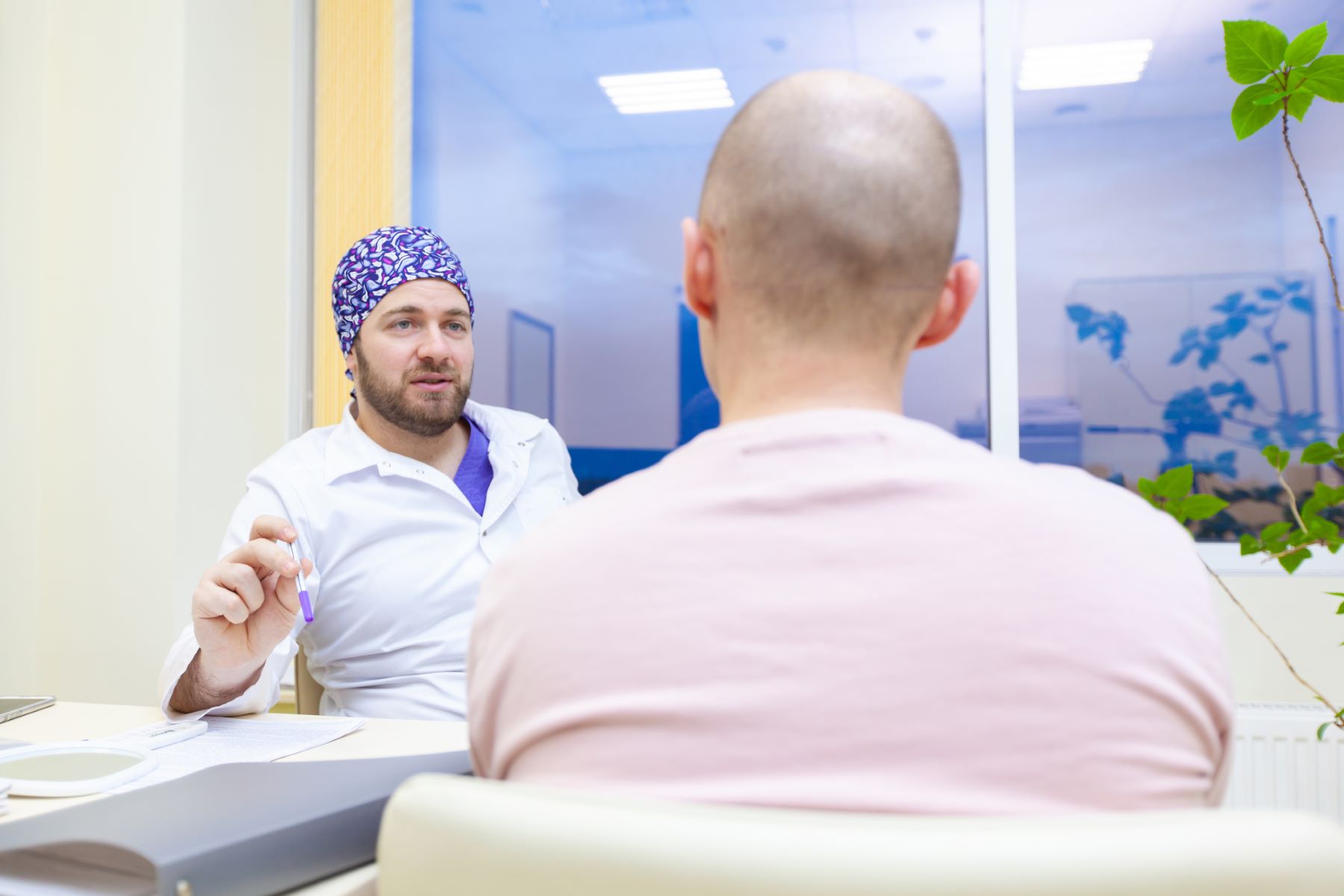 Surgeon providing aftercare instructions