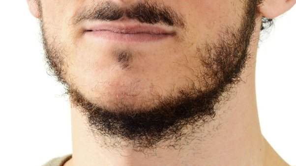 Young man with a sparse beard