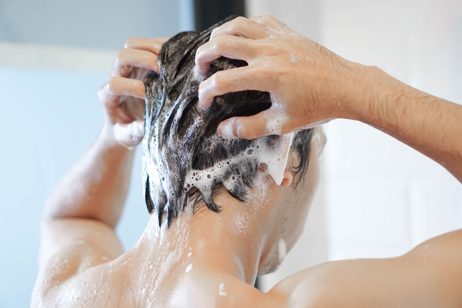 Man washing his hair