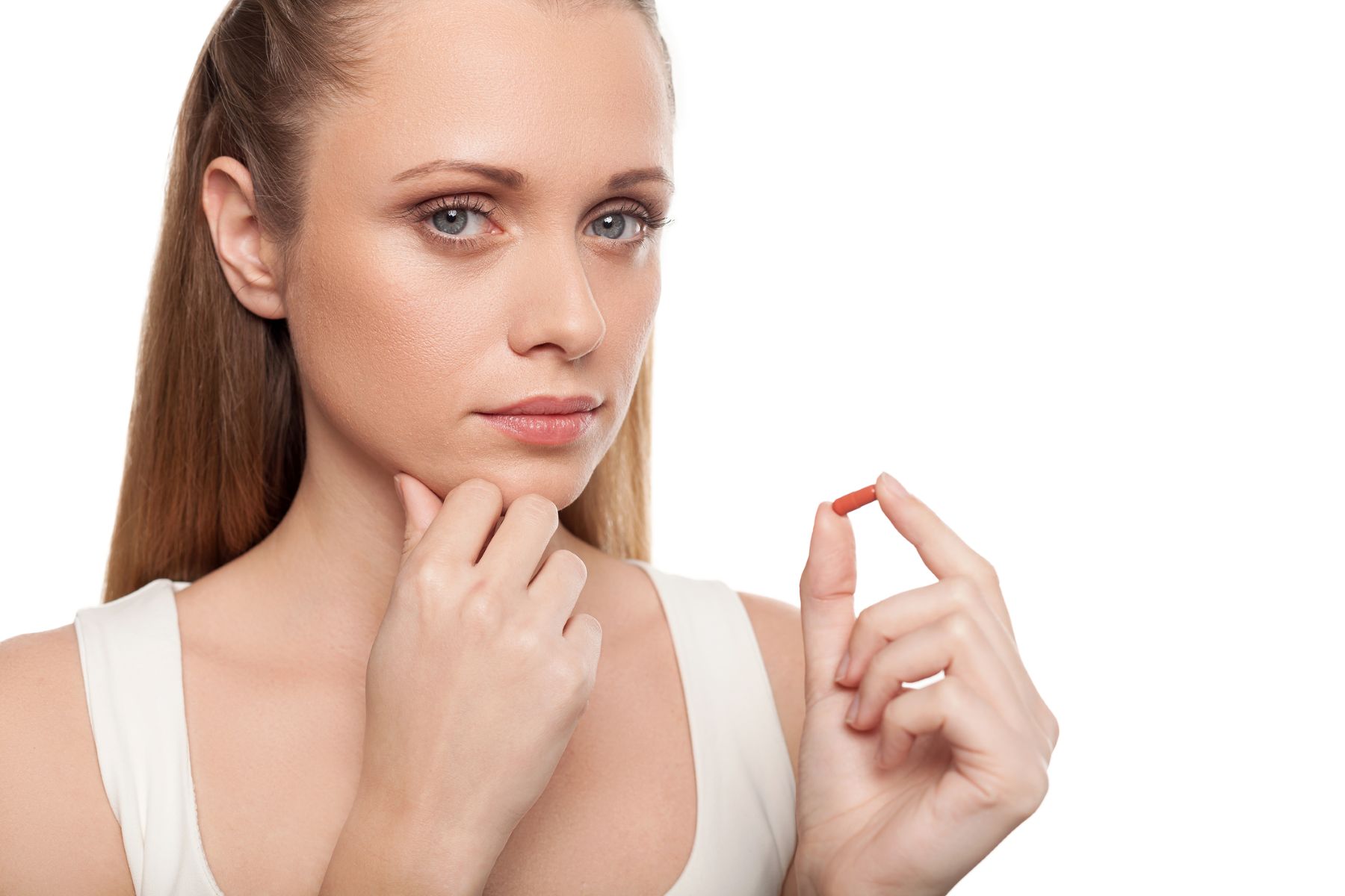 Woman taking probiotics for hair growth
