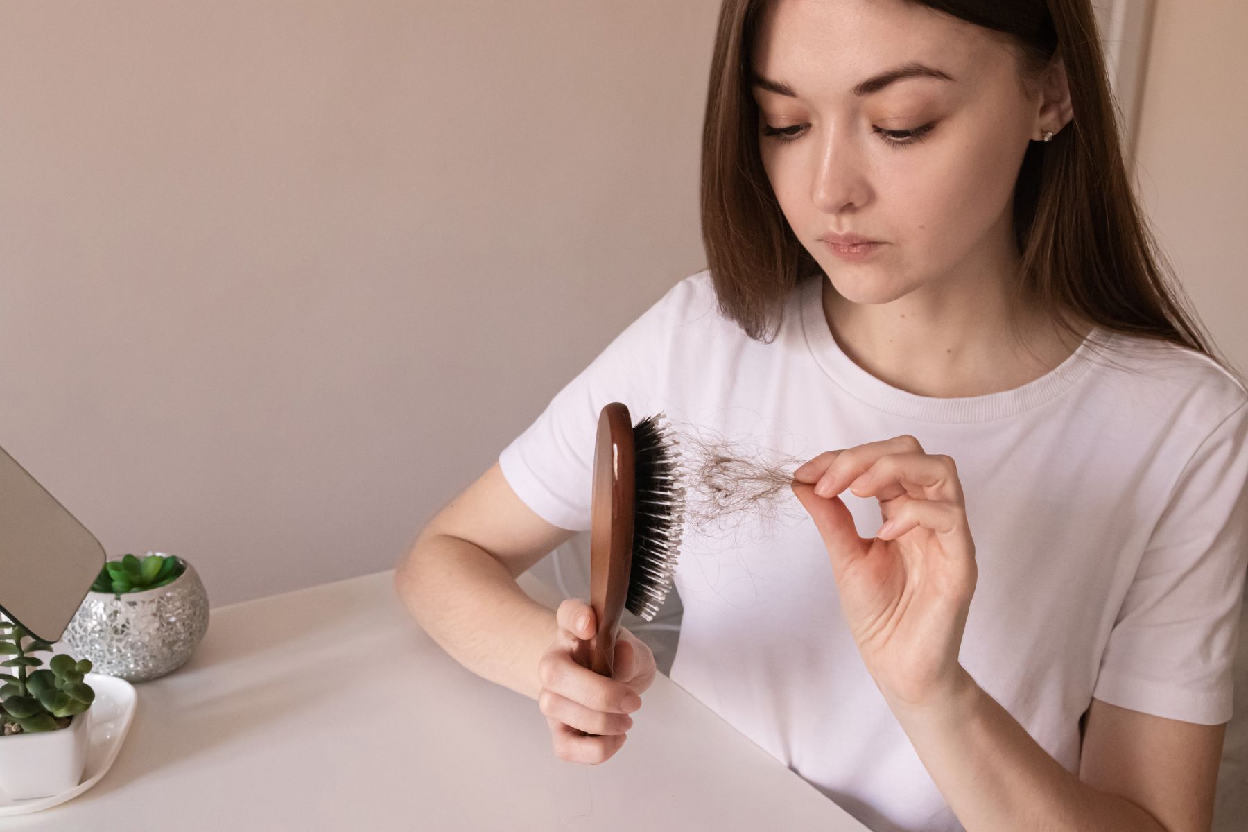 woman experiencing hair loss