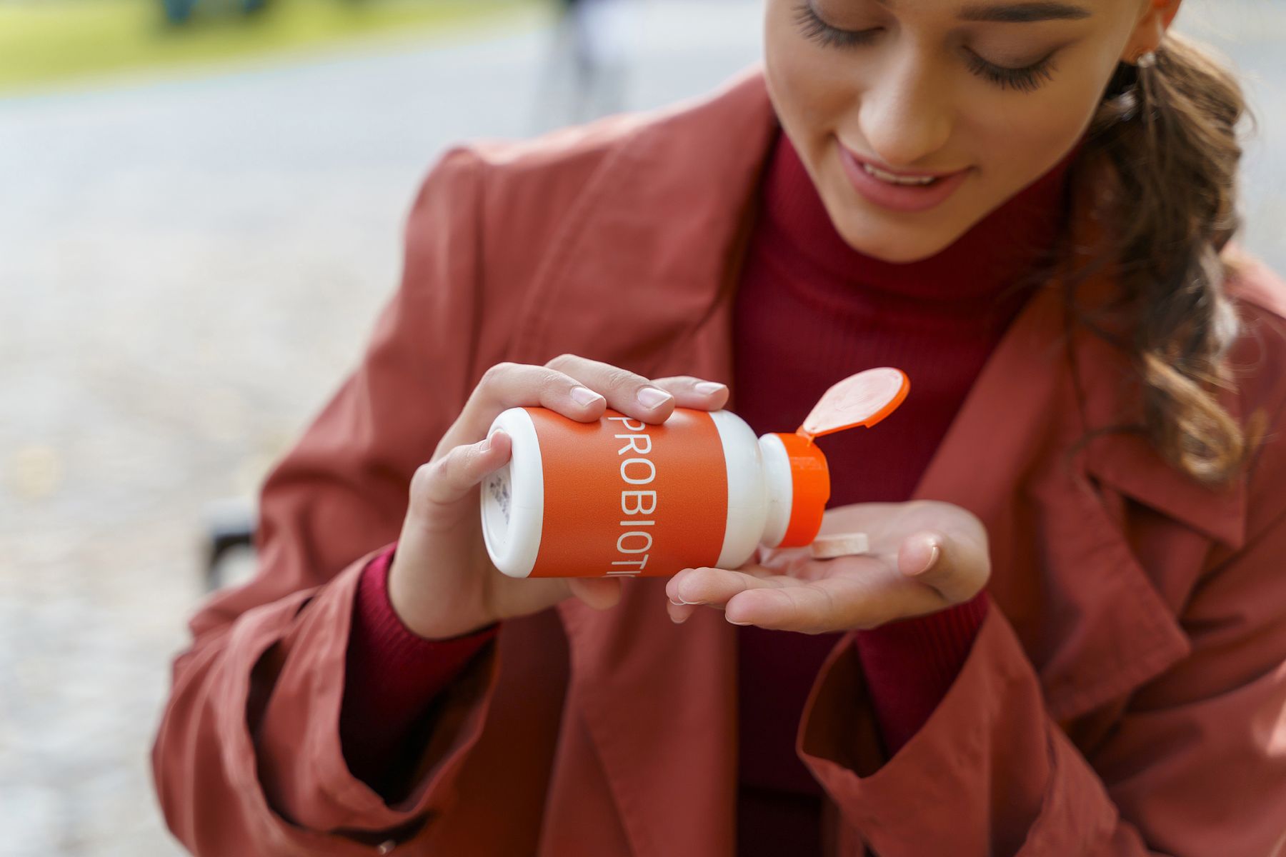 woman taking the best probiotics for hair growth