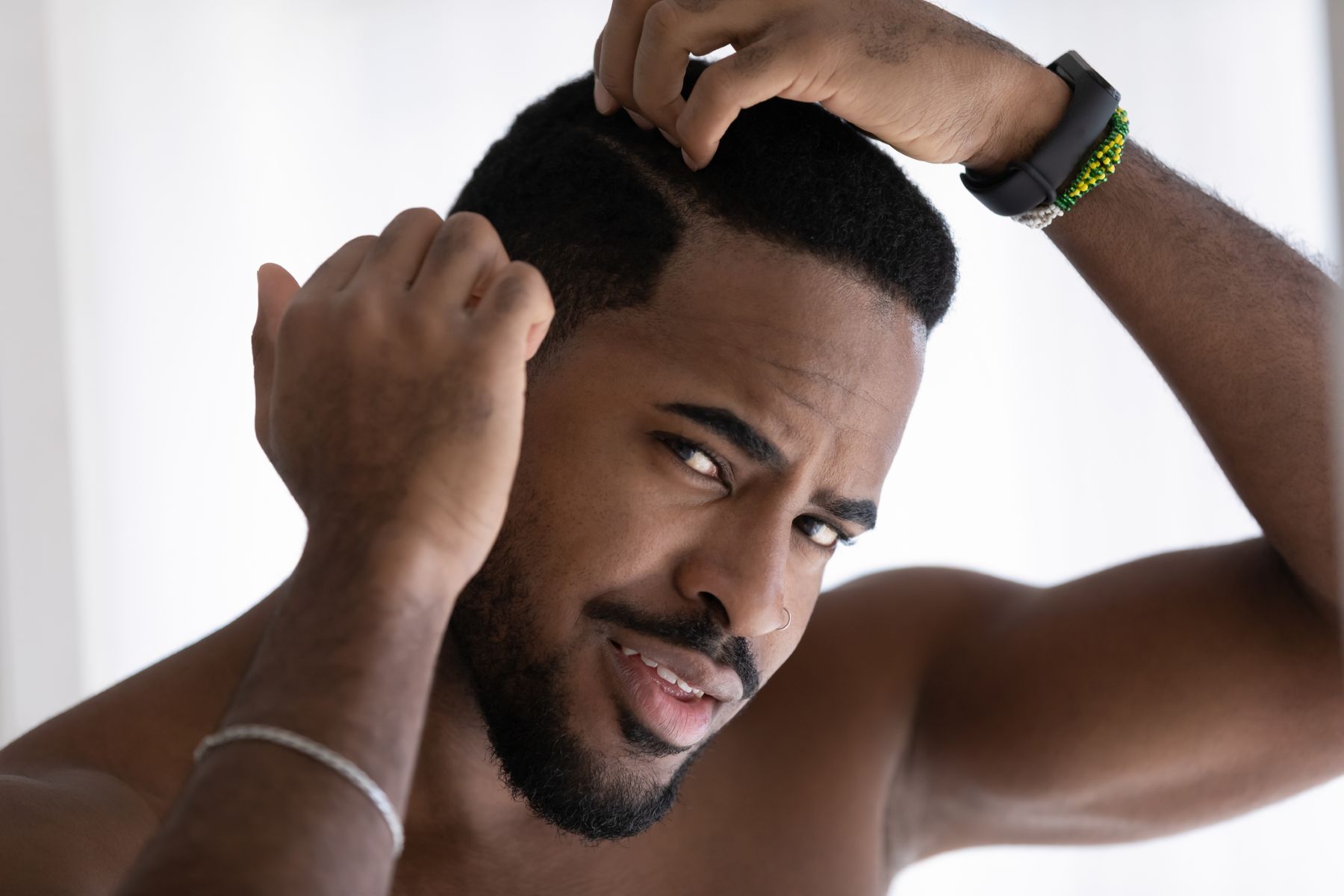 Man wondering if his dry hair leads to hair loss